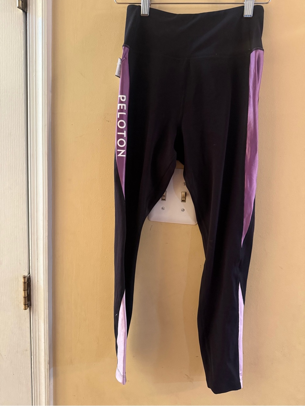 Peloton Women's Speed Colorblock leggings feature purple accent stripes, small